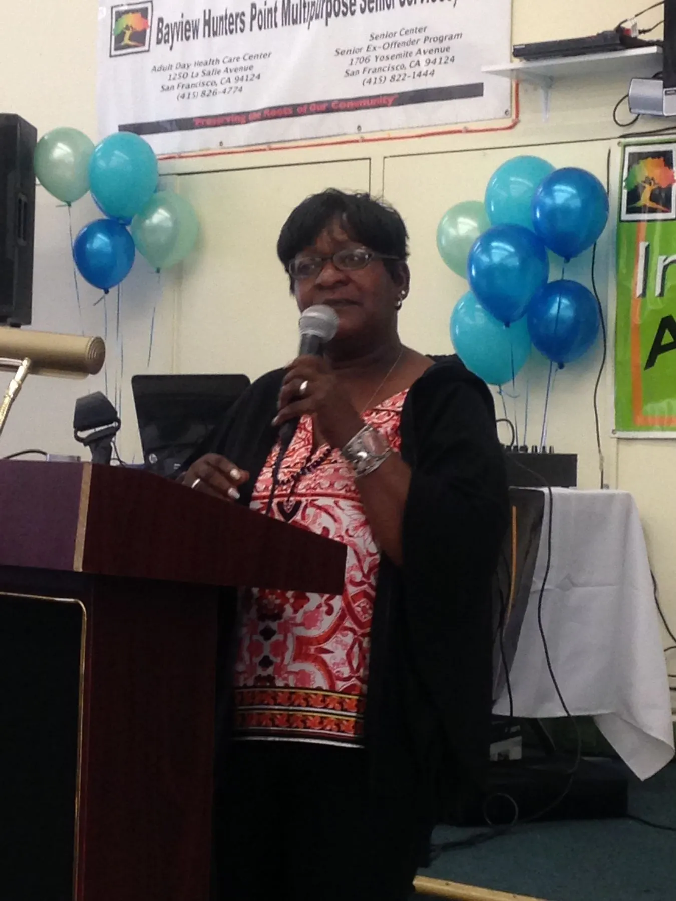A speaker at the podium during the fundraiser