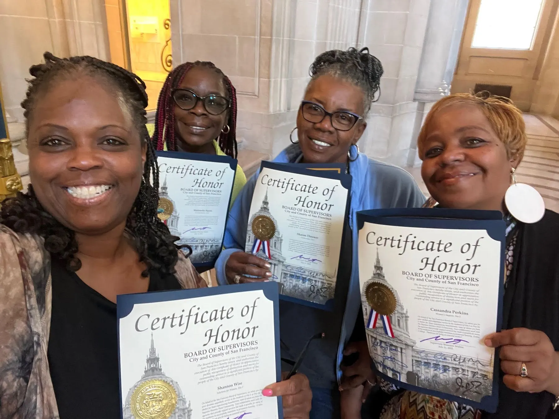 Members holding their Certificates of Honor