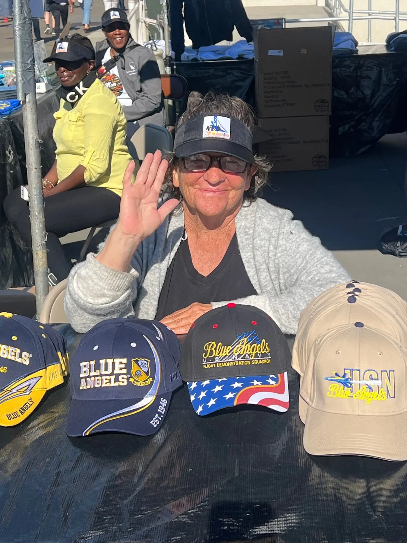 A volunteer at the Solutions for Women Fleet Week booth